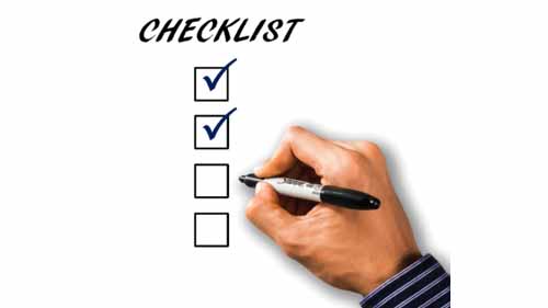 A person marking a checklist