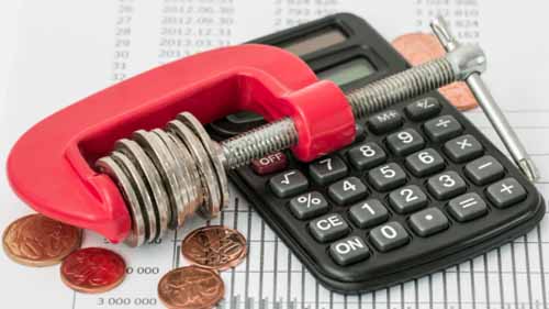 A calculator next to calipers with found