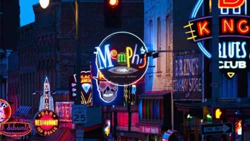 Assorted neon signs along a street